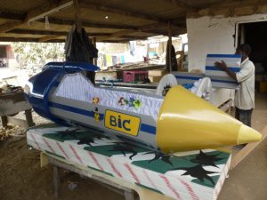 The choice of coffin model is most often determined by the occupation of the deceased." Kane Kwei Carpentry Workshop The choice of coffin model is most often determined by the occupation of the deceased." Kane Kwei Carpentry Workshop